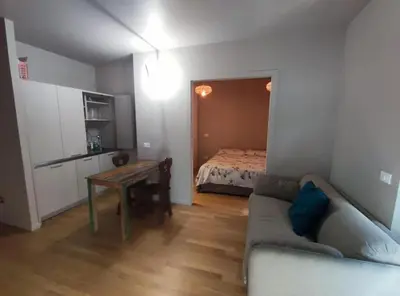 a living room with a couch and a bed at 150 m dal Colosseo - Appartamento Minerva in Rome