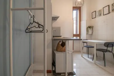 a room with a bed and a flat screen tv at Long John Apartment in Rome