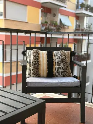a mirror hanging on a wall with a room at Tiburtina FLAM guest house in Rome