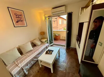 a living room with a couch and a table at La Rosa di piazza Spagna in Rome