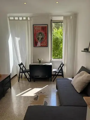 a living room with a couch and a table at House of Mia in Prati in Rome