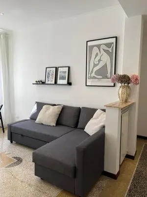 a living room with a couch and a table at House of Mia in Prati in Rome