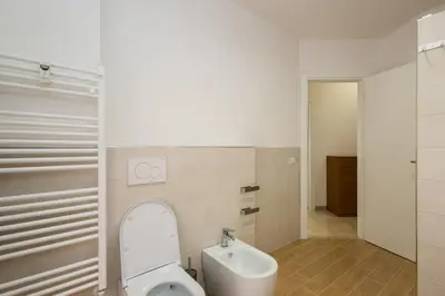 a bathroom with a toilet and a sink at Jmartins Vatican 2 in Rome