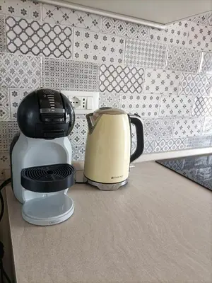 a coffee maker and a toaster sitting on a counter at La Terrazza sull'Appia by Hostand in Rome