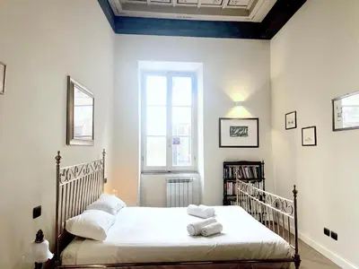 a living room with a couch and a table at Trevi Luxury in Rome