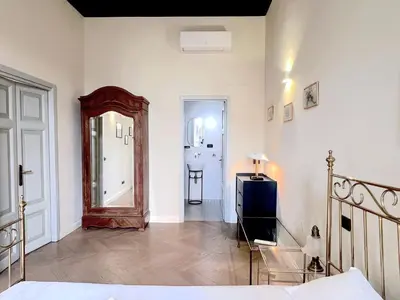 a living room with a couch and a table at Trevi Luxury in Rome