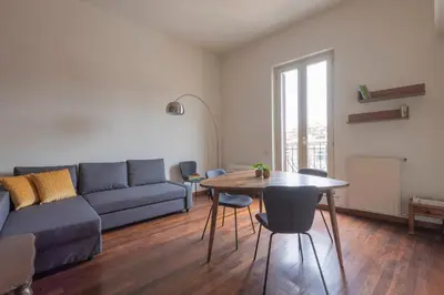 a living room with a couch and a table at Colosseum Loft - ZENO 12 in Rome