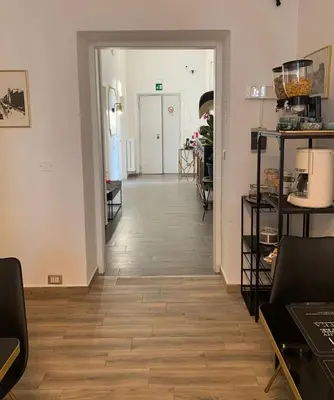 a bathroom with a toilet and a sink and a mirror at Molly Home in Rome