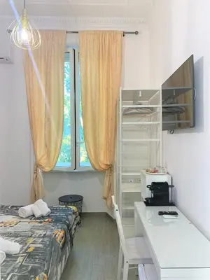 a living room with a bed and a couch at Molly Home in Rome