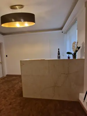 an empty room with a counter and a light at Cuma Suites in Rome