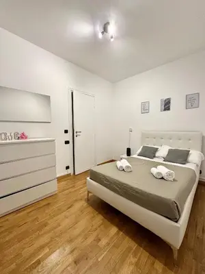 a bedroom with a bed with two towels on it at Maison DaLù in Rome