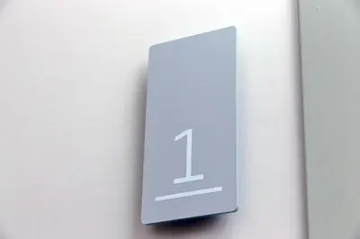 a sign on a wall with the number one on it at YCH-Montebello - Rooms in Rome