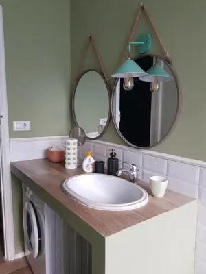 a bathroom with a sink and a mirror at Roma Testaccio - Volta 45 apartment in Rome