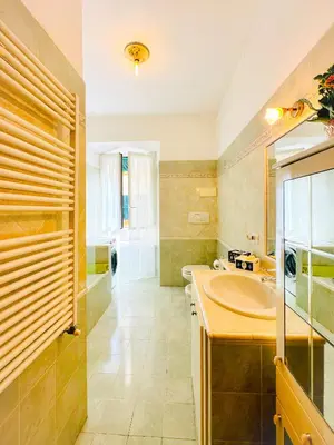 a bathroom with a sink and a tub at Giardino degli Aranci Lulus Home in Rome