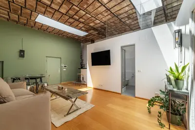 a living room with a couch and a table at GuestHost - Cancelleria Rooftop Garden in Rome