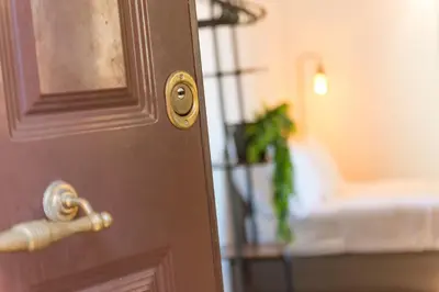 a close up of a door with a plant in a bedroom at Studio in Trastevere Village in Rome