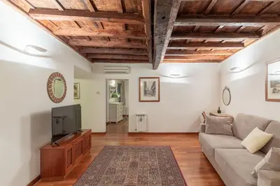 a living room with a couch and a tv at iFlat Comfy Apartament in Campo de' Fiori in Rome
