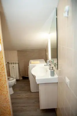 a bathroom with a sink and a toilet at Magenta Terrione 2 in Rome