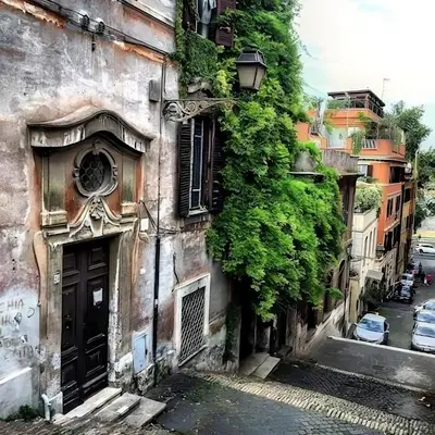 an old building with plants on the side of it at Le Scale di Roma in Rome