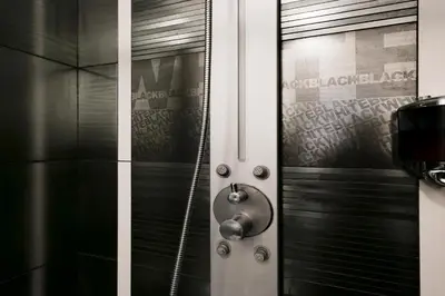 a shower with a glass door in a bathroom at DM69 - Termini Monti Crossroads in Rome