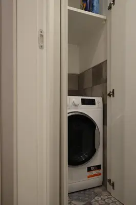 a microwave oven sitting inside of a pantry at Suite RHome In Vatican in Rome