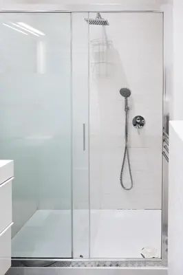 a shower with a glass door in a bathroom at Family apartment near Vatican Museum in Rome