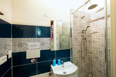a bathroom with a sink and a shower at B&B La stanza di Zoe - Roma Tre Metro B Marconi in Rome