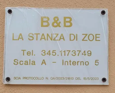a sign on the side of a building at B&B La stanza di Zoe - Roma Tre Metro B Marconi in Rome