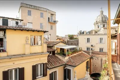 a view of the roofs of buildings in italy at Piazza Navona Center House in Rome