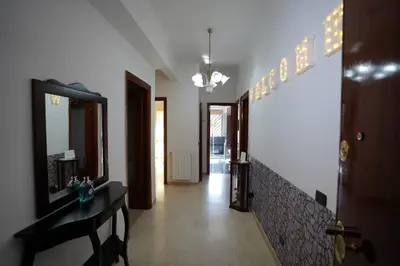 a hallway with a mirror and a sink in a room at Big Flat Rome Metro C in Rome
