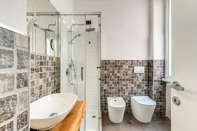 a bathroom with a shower and a sink and a toilet at Effe Luxury Palace in Rome