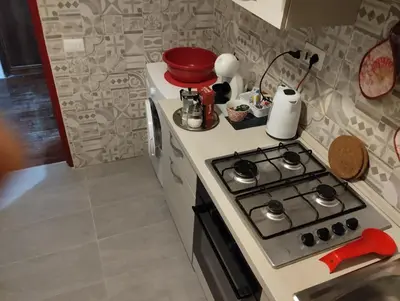 a kitchen with a stove top oven in a kitchen at DaMa Domus in Rome