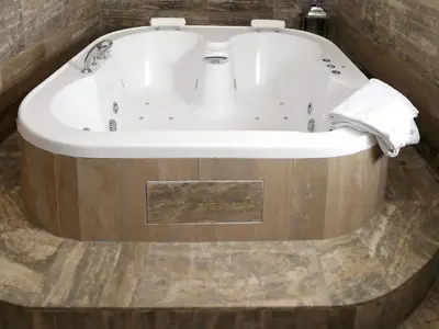 a bath tub in a bathroom with a sink at Piccolo di Piazza di Spagna Suites in Rome
