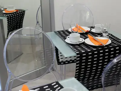 a table with chairs and plates of food on it at Piccolo di Piazza di Spagna Suites in Rome