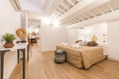 a bedroom with a large bed in a room at Thebestinrome Orbitelli in Rome