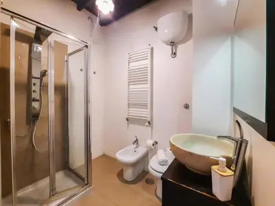 a bathroom with a sink and a shower and a toilet at EasyTopStay - Castel Sant'Angelo Cosy Flat in Rome