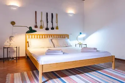 a bedroom with a bed with two pillows on it at EasyTopStay - Castel Sant'Angelo Cosy Flat in Rome