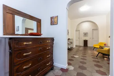 a room with a dresser with a mirror on it at Principe Amedeo By Rental in Rome in Rome