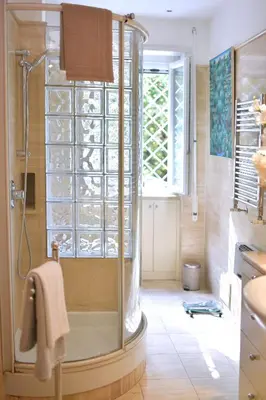 a white living room with a white couch and bookshelves at Incanto Italiano in Rome