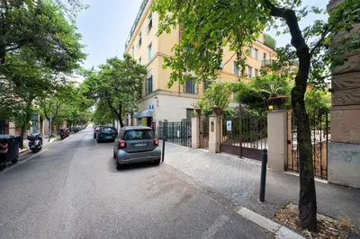 a small car parked on the side of a street at La Divina Duse in Rome