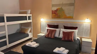 a bedroom with a bed and a bunk bed at IN ROMA LIFE in Rome