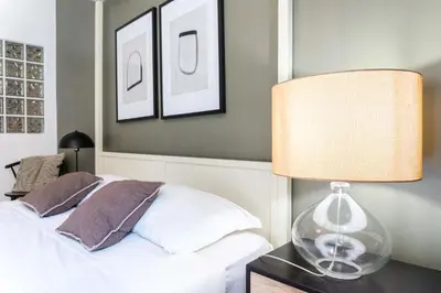 a bedroom with a bed and a lamp on a table at EasyTopStay - Piazza Navona Charming Apartment in Rome