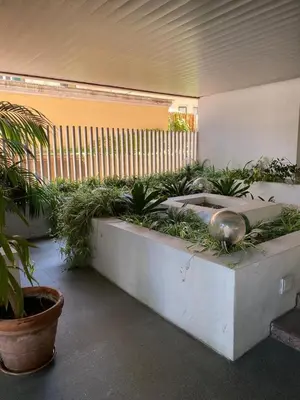 a room with plants on a bench in a building at Giulio Cesare Holiday House in Rome