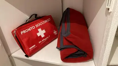a red bag sitting on top of a shelf at La casa dell’Appio in Rome