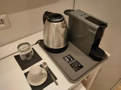 a coffee maker sitting on top of a counter at BePlace Holy See in Rome
