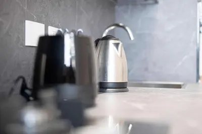 a tea kettle sitting on a counter in a kitchen at Vatican Suite Apartament Roma in Rome