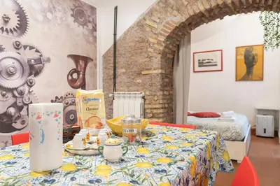 a table with food on it in a room at Casa De' Medici in via Giulia in Rome