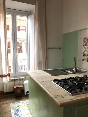 a kitchen with a sink and a stove top at Large apartment in Rome city center in Rome