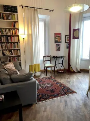 a living room with a couch and a table at Large apartment in Rome city center in Rome