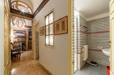 a bathroom with a sink and a mirror at GuestHost - Pantheon Apartment - L'angolo nascosto dei quadri in Rome